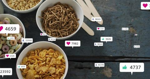 Displaying four cereal bowls on rustic blue table with social media reaction bubbles