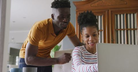 Happy Couple Collaborating on Financial Planning at Home