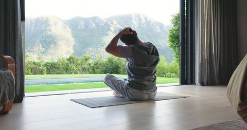 Serene Morning Yoga Overlooking Majestic Mountains at Home