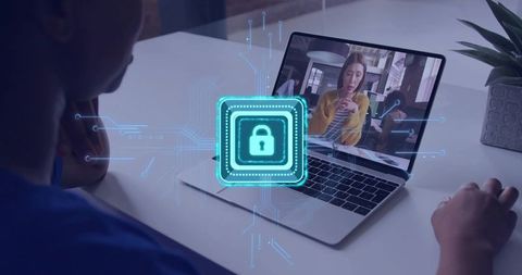 Holographic Lock Protecting Laptop During Remote Video Call Representing Cybersecurity