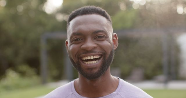 Smiling Man Outdoors with Bokeh Background - Download Free Stock Images Pikwizard.com