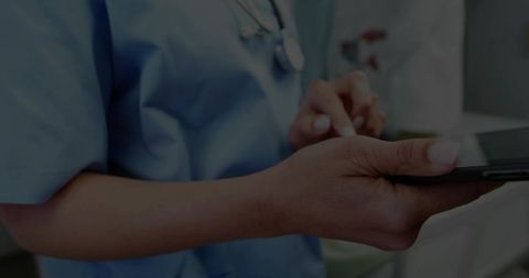 Medical Professional Using Tablet in Modern Clinic