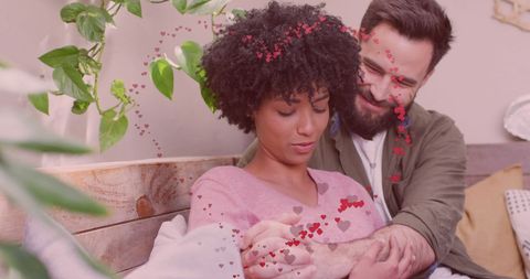 Romantic Diverse Couple Embracing with Digital Hearts