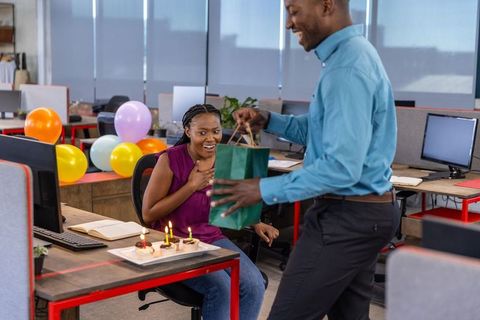 Coworkers Celebrating Birthday in Modern Office Environment