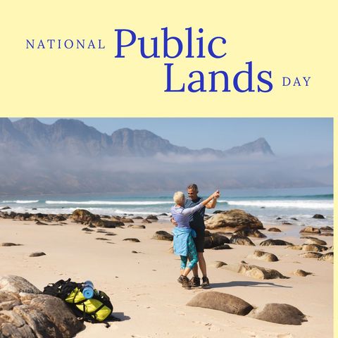 Elderly couple dancing on rocky beach during national public lands day