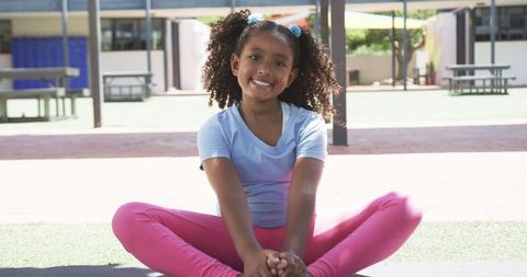 Smiling Girl Enjoying Sunny Day at Schoolyard in Slow Motion