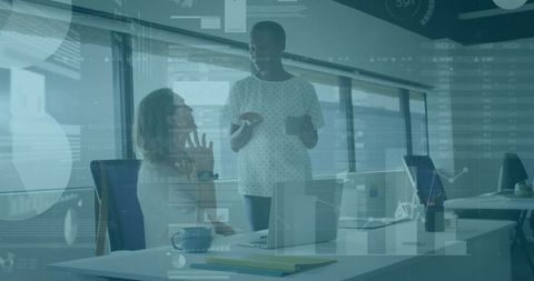 Colleagues Analyzing Data Charts and Collaborating in Modern Office