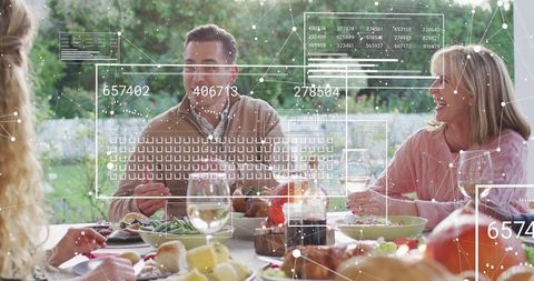 Multigenerational family sharing backyard dinner with augmented reality overlays