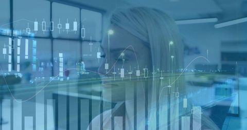 Blonde financial analyst studying candlestick charts and market data visualization at desk