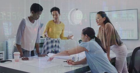 Diverse team collaborating on financial strategies in office