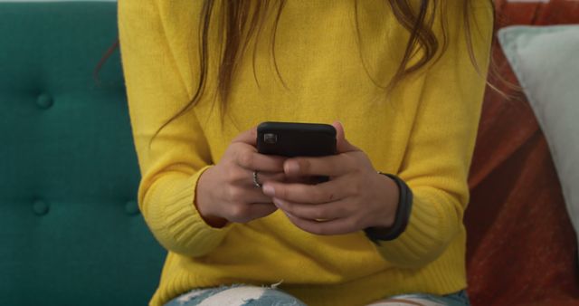 Young Woman Texting on Smartphone in Casual Setting - Download Free Stock Images Pikwizard.com