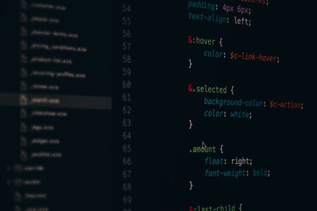Close-up view of coding on a computer screen showing colorful syntax highlighting. Ideal for portraying the process of web development or software programming. Great for use in articles about technology, coding tutorials, or educational material related to computer science.
