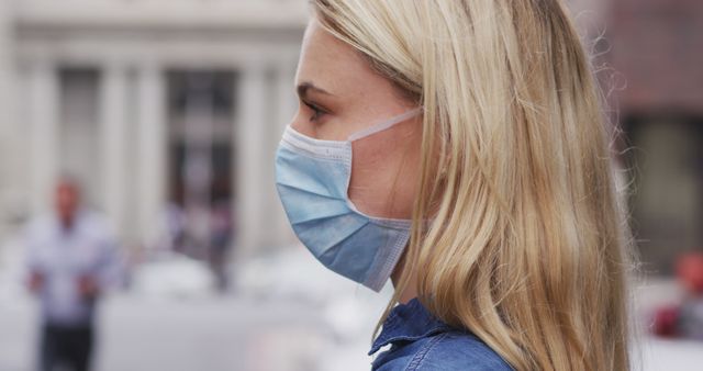 Woman Wearing Protective Face Mask in Urban Setting - Download Free Stock Images Pikwizard.com