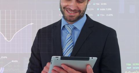 Businessman in Suit Reviewing Financial Charts on Tablet with Data Overlays