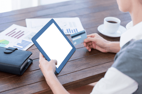 Transparent screen tablet, holding credit card in office setting - Download Free Stock Videos Pikwizard.com