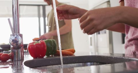 Preparing Fresh Vegetables Together in Modern Kitchen