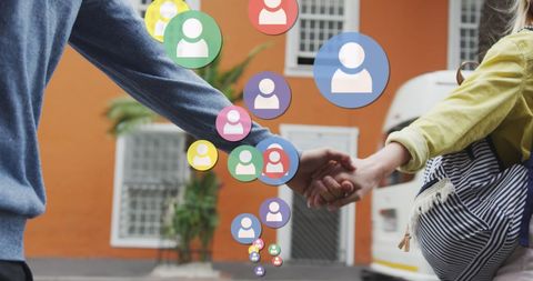 Couple holding hands with social media icons overlay