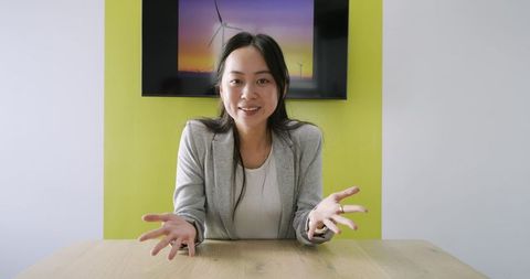 Confident Professional Gesturing in Sustainable Office Space