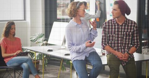 Creative Team Collaborating in Modern Office About Innovations