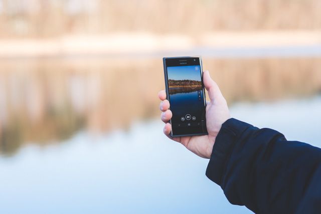 Person Taking Photo of Lake with Smartphone at Dawn - Download Free Stock Images Pikwizard.com