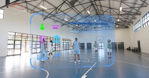 Basketball team practicing with augmented reality hud overlay in sunlit indoor court