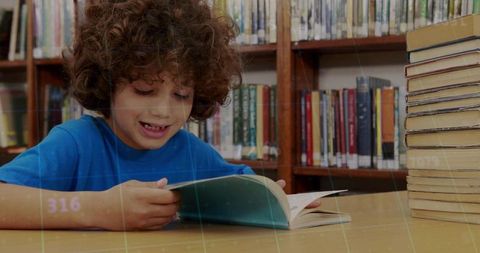Curly-haired boy reading at library table with stack of books, cozy learning moment