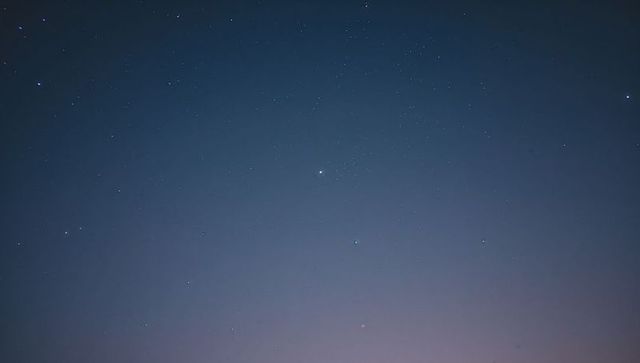 Starry Night Sky with Bright Planet in Tranquil Twilight