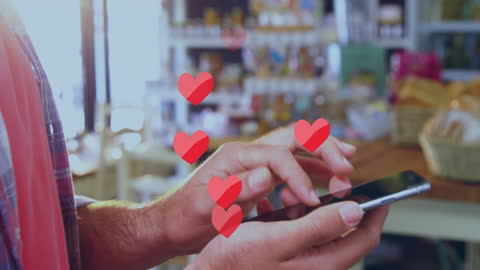 Hands Typing on Smartphone Surrounded by Floating Hearts