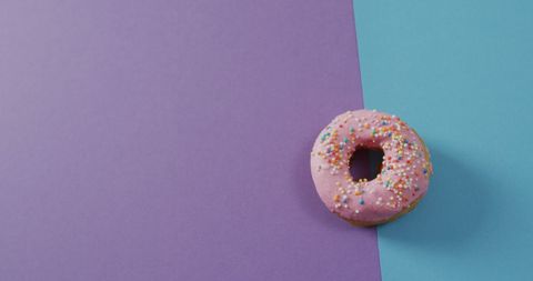 Pink Donut with Sprinkles on Pastel Background