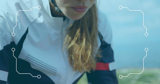 Focused female cyclist wearing sportswear and riding bicycle outdoors, promoting an active and healthy lifestyle. Ideal for fitness and sports campaigns, outdoor adventure themes, and health-oriented advertisements.