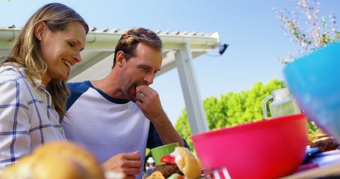 Happy Couple Enjoying Outdoor Meal in Garden - Download Free Stock Images Pikwizard.com