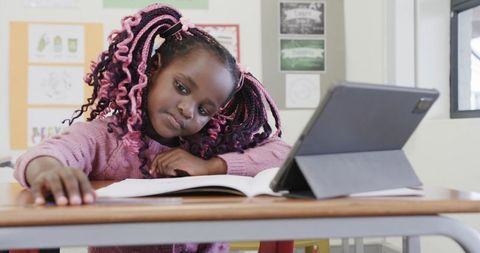 Young Girl Balancing Study with Technology in Classroom Environment