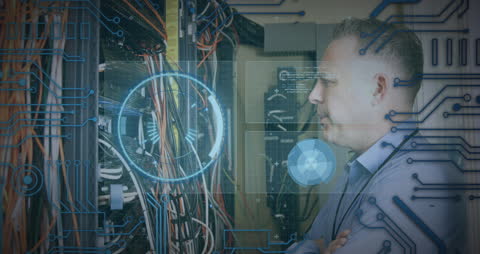 IT Specialist Monitoring Server Data with Holographic Interface