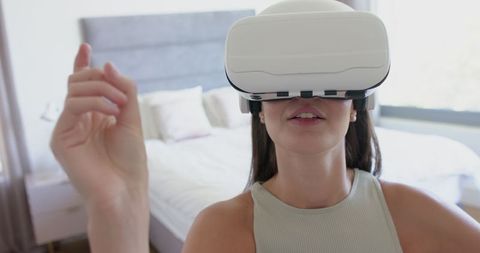 Teen Girl Immersed in Virtual Reality Simulation at Home
