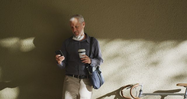 Mature Businessman Living Sustainable Lifestyle with Coffee and Bike - Download Free Stock Images Pikwizard.com