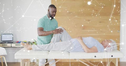 Physiotherapist assessing elderly woman knee mobility on treatment table during rehab