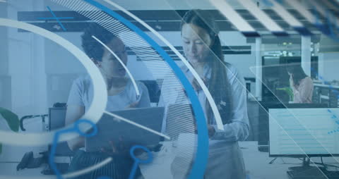 Diverse Business Team Engaging with Financial Data in Modern Office