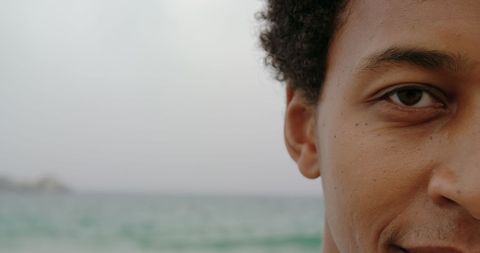 Close-Up of Man Smiling Near Ocean