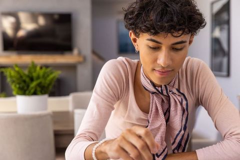 Creative man engaged in craft project at home