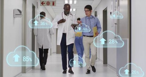 Medical team walking hospital corridor using tablet and augmented reality cloud metrics