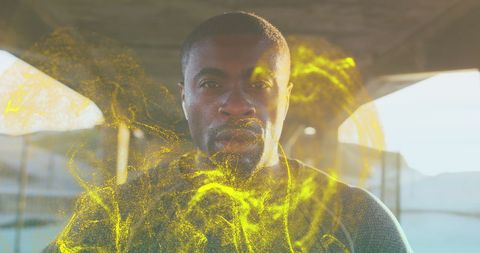 Fit african american man with golden digital wave visualization
