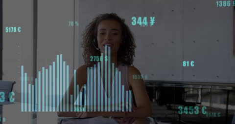 Businesswoman Analyzing Financial Data with Graphs in Office