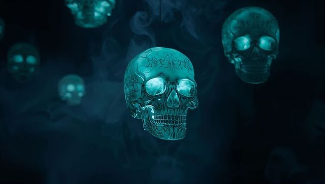 Floating ornate skull with mystical teal wisps