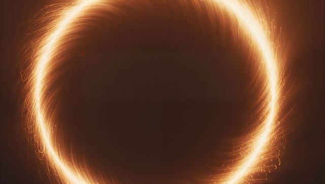 Glowing Circular Light Ring with Spark Trails
