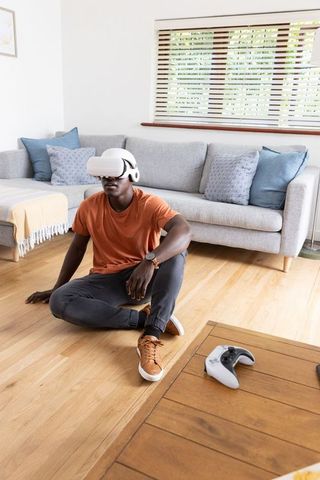 Man Experiencing Virtual Reality Gaming at Home