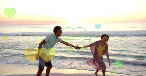 Romantic Beach Couple Dancing at Sunset with Heart Overlays