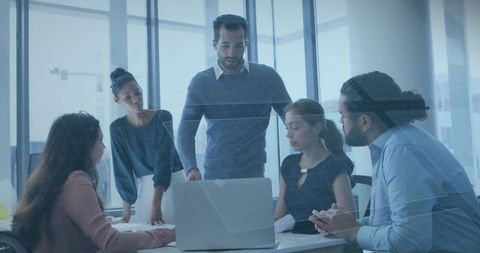 Middle eastern leader facilitating modern office meeting