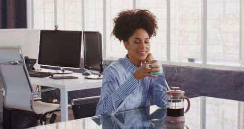 Businesswoman Enjoying Coffee Break at Modern Office Workspace - Download Free Stock Images Pikwizard.com