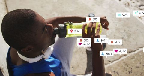 Athlete hydrating with social media notifications concept