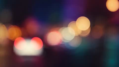 Abstract Bokeh of Car Taillights on Street at Night